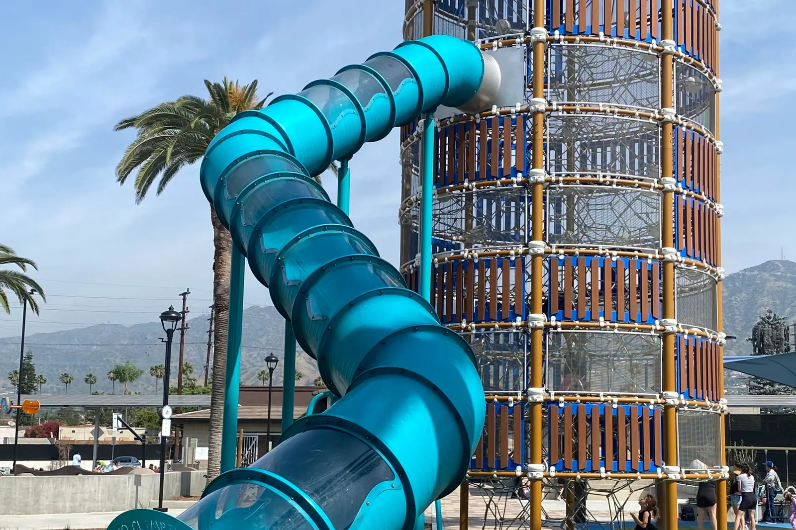 The giant blue tube slide and climbing tower at Fremont Park in Glendale, with the Verdugo Mountains behind