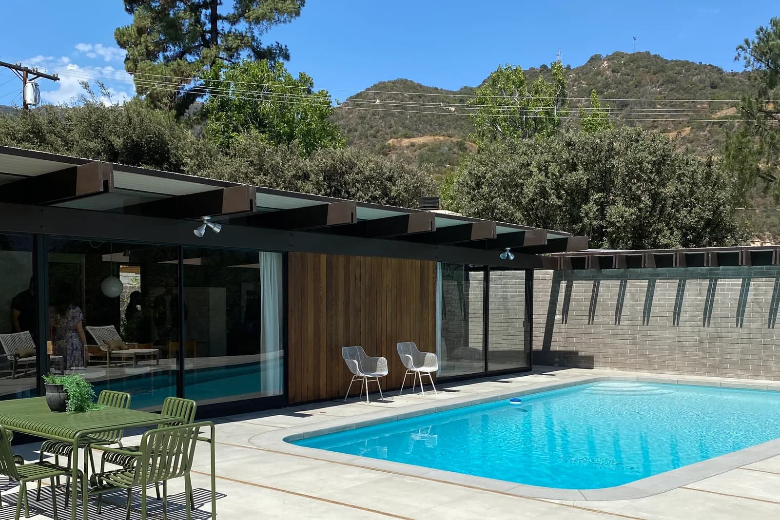 Mid-century post-and-beam home in La Cañada Flintridge with a pool and the hills behind